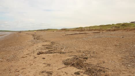 Low-angle-shot-of-vacant-Sand-Bay-Beach-in-Weston-super-Mare,-England-during-afternoon