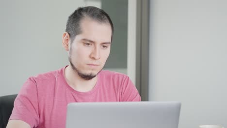 Young-Latin-American-Man-Working-on-Laptop-in-Office