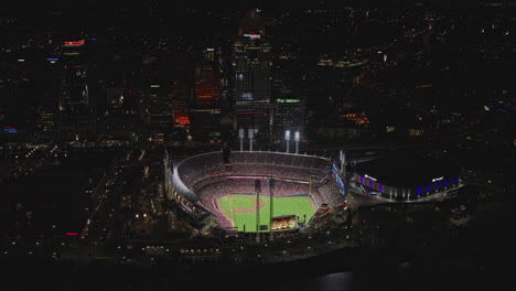 Cincinnati-Ohio-Aerial-v41-flyover-river-capturing-downtown-night-cityscape,-birds-eye-view-of-major-baseball-league-game-playing-in-Great-American-Ball-Park---Shot-with-Inspire-3-8k---September-2023