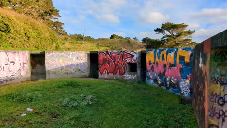 Inside-WW2-bunkers-covered-in-graffiti-at-The-Massey-Memorial,-Point-Halswell-in-Wellington,-New-Zealand-Aotearoa