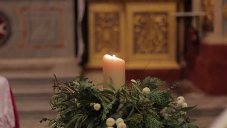 A-foreground-shot-of-a-candle-at-the-Co-Cathedral-in-Valletta,-Malta