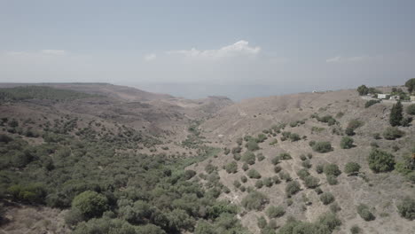 Ein-Peak---spring-in-the-south-of-the-Golan-Heights-area-and-a-remains-of-Syrian-village,-close-to-Kibbutz-Afik---Sea-of-Galilee-in-the-background--Dlog