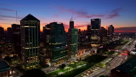 Aerial-zoom-in-drone-view-of-a-beautiful-sunset-of-Catalinas-buildings-in-the-city-of-Buenos-Aires,-Argentina