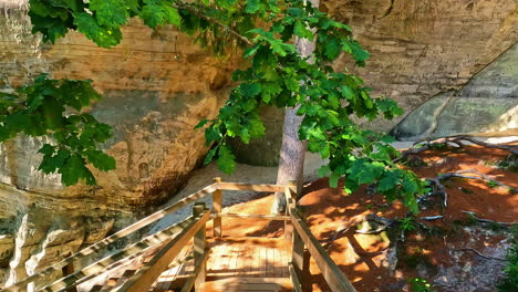 POV-shot-of-climbing-down-the-wooden-staircase-in-Gauja-National-Park-in-Latvia-during-afternoon