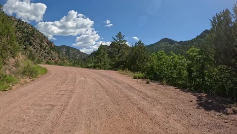 POV---Driving-on-Phantom-Canyon-Road-with-steep-granite-embankments-in-the-Front-Range-of-the-Rocky-Mountains-in-Colorado