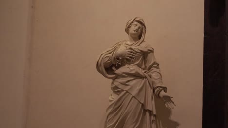 A-tilt-down-shot-of-a-beautiful-marble-statue-of-the-Virgin-at-the-Co-Cathedral-of-Saint-John-in-Valletta,-Malta