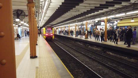 Buenos-Aires-City-people-travel-at-underground-subway-transportation-of-Argentina,-train-departing-in-motion