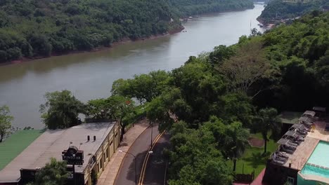 Aerial-view-about-the-hotel-street-detail-and-Iguazu-river,-Puerto-Iguazú,-Argentina