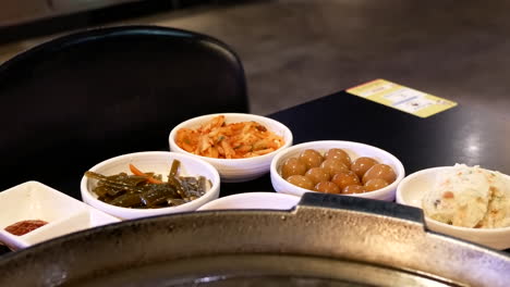 The-motion-of-several-appetizers-on-a-table-inside-a-Chinese-restaurant-with-4k-resolution