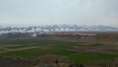 An-aerial-shot,-captured-by-drone-of-a-rural,-agricultural-landscape-in-a-remote-village-setting-located-within-Afghanistan