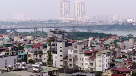 This-footage-captures-a-hazy-day-in-Hanoi,-Vietnam,-featuring-a-mix-of-urban-buildings