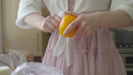 Girl-prepares-yellow-tomatoes-for-eating