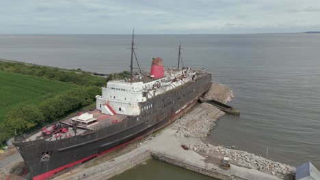 An-aerial-view-of-the-of-the-Duke-of-Lancaster-ship-at-Llannerch-y-Mor-Wharf-in-North-Wales-on-a-cloudy-day