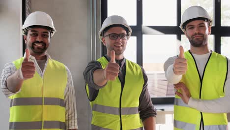 Male-Builder-in-Helmet-and-Safety-West-at-Office