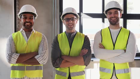 Male-Builder-in-Helmet-and-Safety-West-at-Office