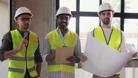 Builder-in-Helmet-with-Clipboard-Walking-Upstairs