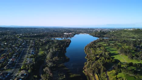 Aerial-drone-view-of-Lake-Murray-Reservoir,-flying-away-to-reveal-surrounding-aeria