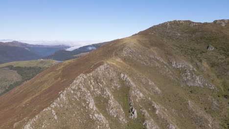 Stunning-aerial-view-of-the-Cantal-Mountains-in-France,-showcasing-the-natural-beauty-of-the-landscape