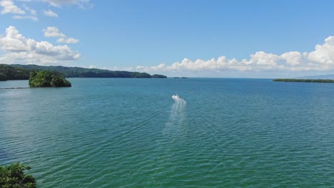 Aerial-Shot-of-the-Boat-in-Los-Haitises:-Discover-the-Tropical-Caye-and-Crystal-Clear-Caribbean-Waters-in-Daylight