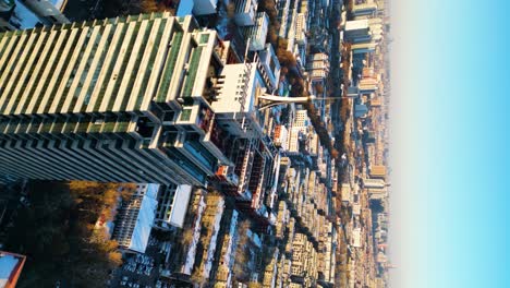 Sunset-light-casts-a-strong-golden-glow-across-a-dense-apartment-building-complex-in-Zibo-in-Shandong-Province,-China