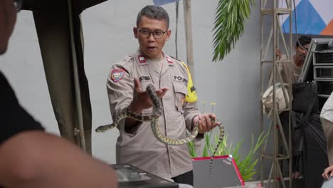 Indonesian-Police--officers-holding-a-snake