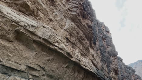 Woman-in-Rio-Grande-River-Under-Cliffs-of-Santa-Elena-Canyon,-Big-Bend-National-Park,-Texas-USA