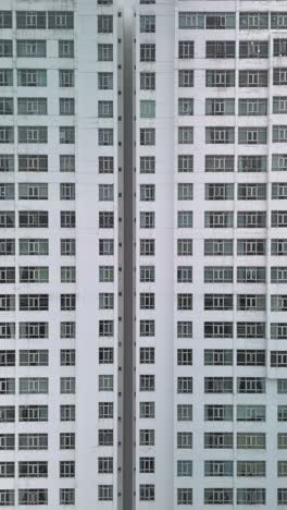 Large-Hi-Rise-Residential-Building-Facades-Aerial-View-with-drone-moving-across-from-right-to-left-in-vertical-format