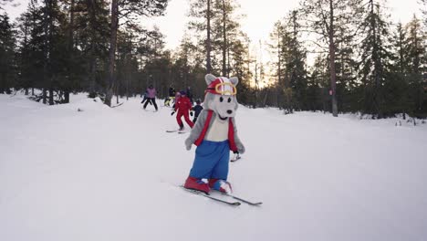 Ski-instructor,-ski-mascot-skiing-downhil-with-children