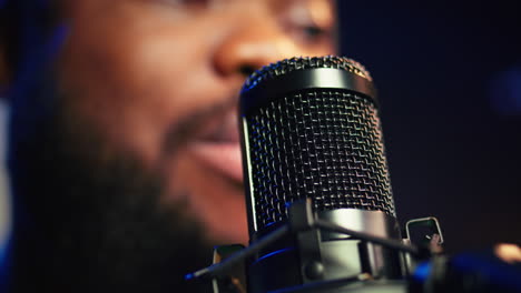 Artist-records-his-voice-on-microphone-in-home-studio-singing-a-song