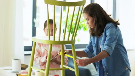 Mother-and-Daughter-with-Ruler-Measuring-Old-Chair