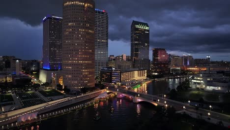 Tampa’s-downtown-skyline,-Hillsborough-River,-colorful-bridge-lights