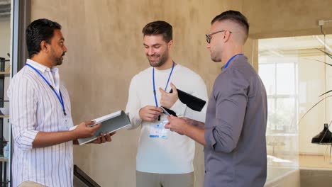 Businessmen-with-Name-Tags-Walking-Upstairs