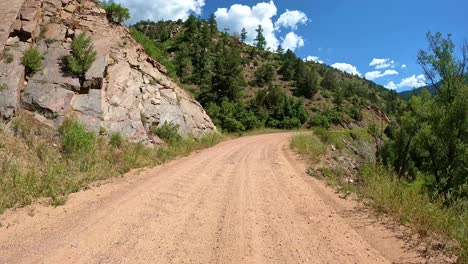 POV---Adventure-driving-on-a-gold-belt-scenic-byway-in-Rocky-Mountains'-Front-Range