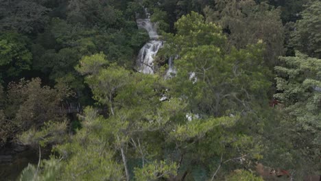 Tamasopo-waterfall,-nature-water-falling-jungle-surrounded-by-cascades,-Mexico