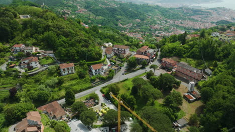 Foce-la-spezia,-italy,-showing-houses-and-greenery-on-a-sunny-day,-aerial-view