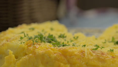 Close-up-decorate-a-spanish-tortilla-with-parsley