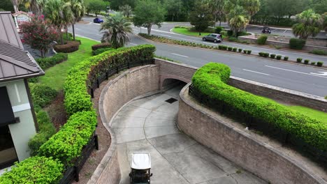 Golf-Carts-coming-out-of-underpass-subway-below-highway-bridge-in-Florida