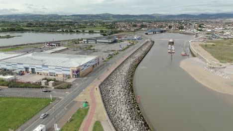 An-aerial-view-of-the-of-the-Welsh-town-of-Kinmel-Bay-in-Denbighshire,-North-Wales,-on-an-overcast-morning