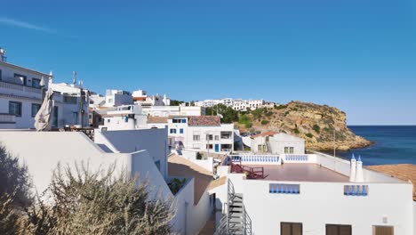 Charming-whitewashed-buildings-in-the-picturesque-village-of-Burgau,-Portugal-on-a-sunny-day