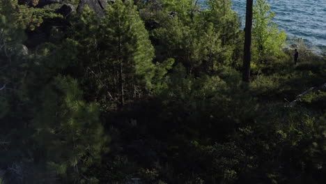 Drone-tilt-up-revealing-the-large-freshwater-lake-Lake-Tahoe-in-the-Sierra-Nevada-Mountains