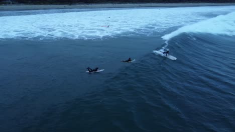 Surfers-on-Pacific-coast-of-Vancouver-Island-in-Canada,-outdoor-watersport