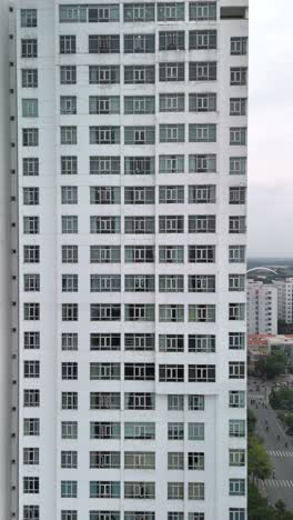 Large-Hi-Rise-Residential-Building-Facades-Aerial-View-with-drone-moving-across-from-right-to-left-in-vertical-format