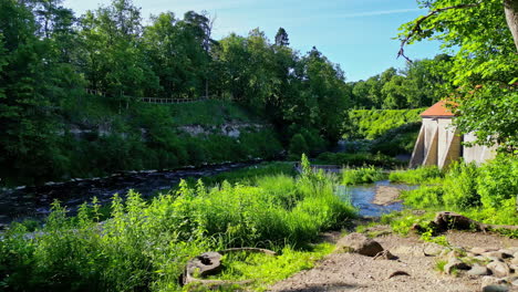 Keila-waterfall-greenery-and-stream,-forward-view,-Estonia