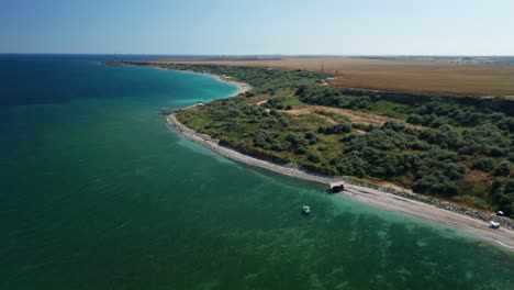 A-scenic-coastline-with-turquoise-waters-and-lush-greenery,-aerial-view