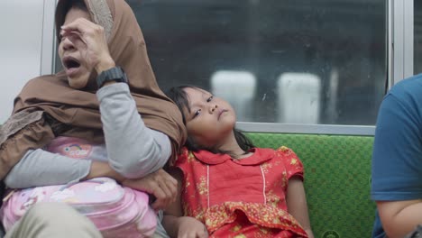 Indonesian-Traveling-On-The-Train-From-Kampung-Bandan-Station-In-North-Jakarta,-Indonesia