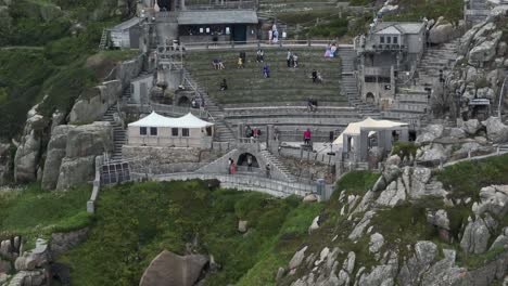 Aerial-static-shot-of-the-famous-Minack-Theatre-carved-into-the-side-of-a-cliff