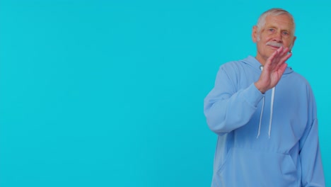 Senior-grandmother-grandfather-walking-opposite-camera,-waving-hands-gesturing-hello-or-goodbye