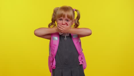 Frightened-school-girl-closing-her-mouth-with-hand,-looking-intimidated-scared-at-camera-gestures-no