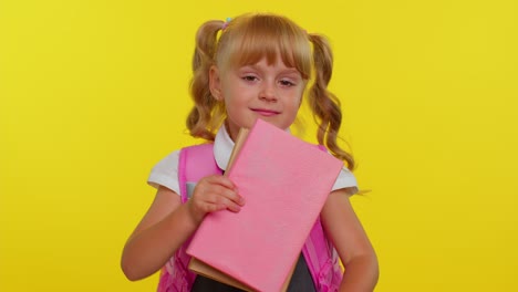 Pretty-positive-kid-primary-school-girl-with-ponytails-wearing-uniform-smiling-on-yellow-background