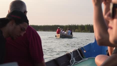 A-view-among-the-people-of-a-boat-cruising-in-the-Valencian-Albufera-at-sunset